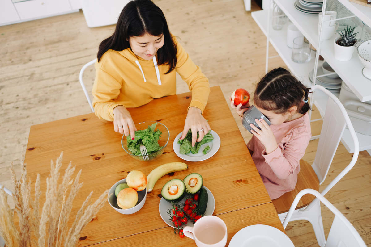 Mother and Daughter Eating a Healthy Breakfast 